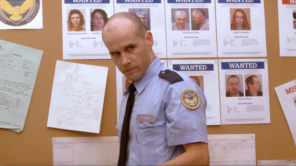 Joshua K Linton as Officer Purdy